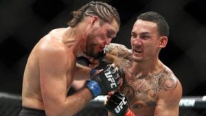 UFC: Watch: Max Holloway teaches Brian Ortega to keep his hands up amidst brutal 4th round beating - Holloway